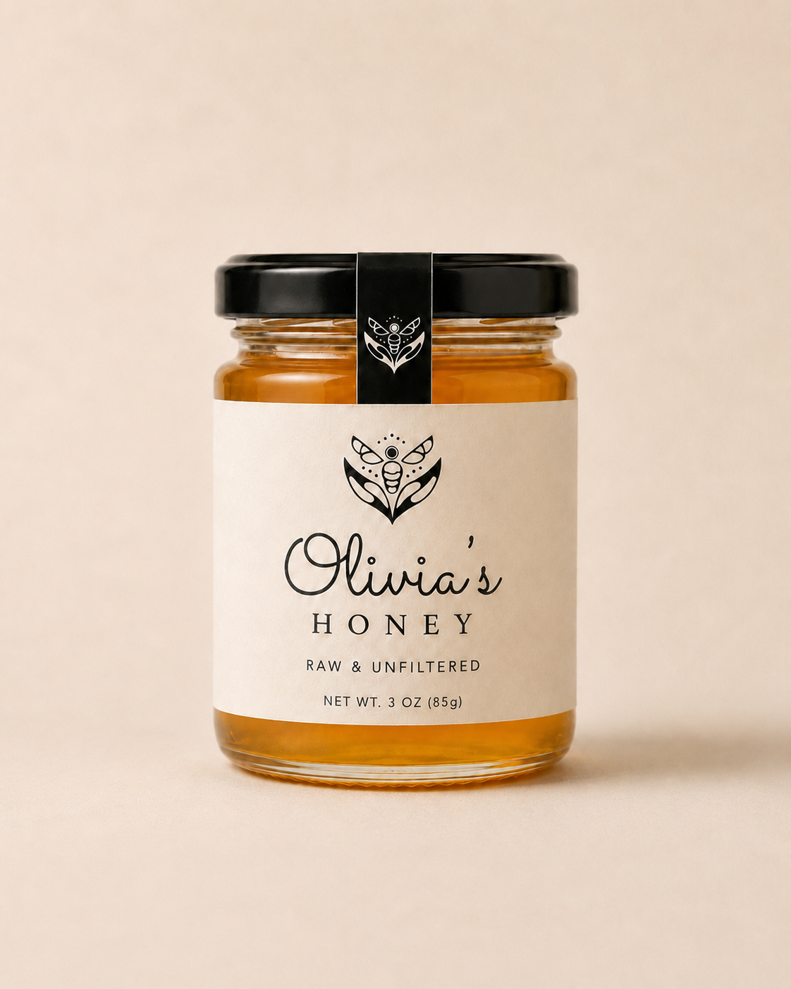 Jar of Olivia's Honey on a beige background